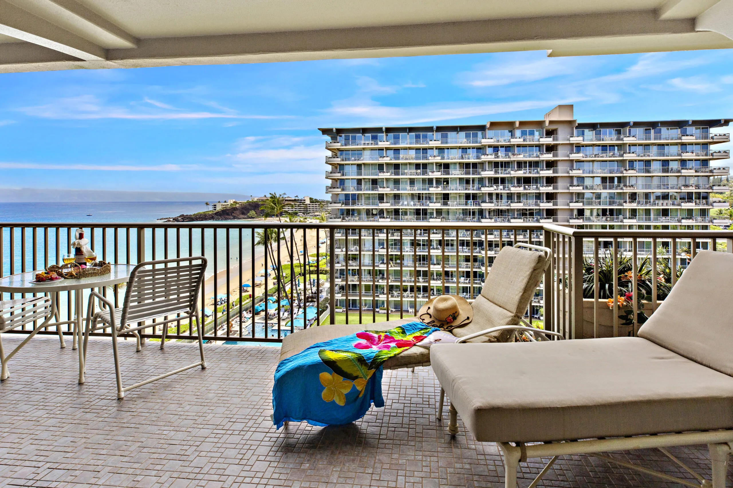 Balcony with lounge chairs and ocean view.